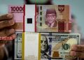 Rupiah Menguat Dibayangi Kebijakan Pengetatan Moneter AS 17 Ilustrasi nilai tukar (kurs) Rupiah terhadap Dolar AS. (Istimewa)